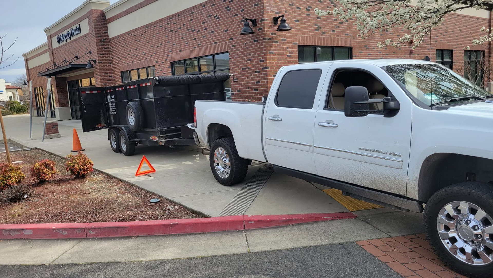 All in All Hauling truck and dump trailer on a commercial property cleanup job in Placer County